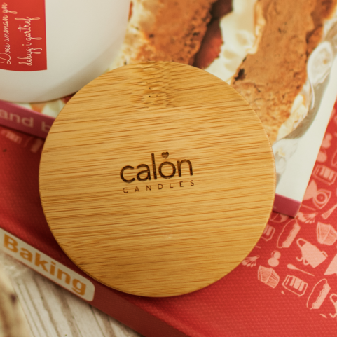 a branded engraved lid with Calon Candles logo