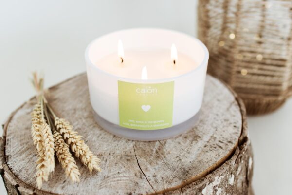 A large Lime, Basil and Mandarin three-wick candle scented candle from Welsh candle company, Calon Home.