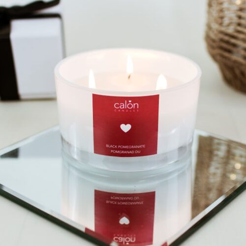 A large Black Pomegranate 3-wick candle scented candle from Welsh candle company, Calon Home.