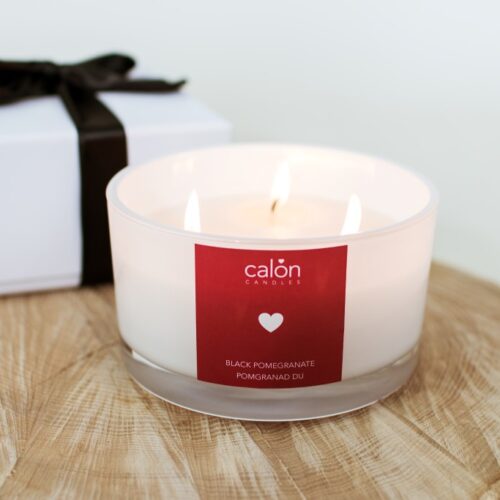 A large Black Pomegranate three-wick scented candle from Welsh candle company, Calon Home.
