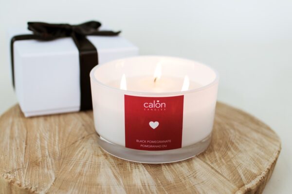A large Black Pomegranate three-wick scented candle from Welsh candle company, Calon Home.