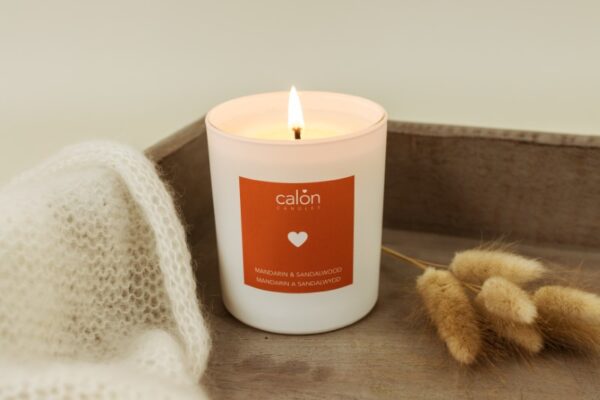 A Mandarin and Sandalwood candle scented candle from Welsh candle company, Calon Home