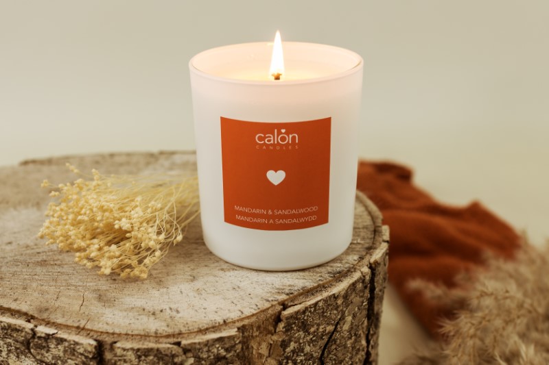 A Mandarin & Sandalwood candle scented candle from Welsh candle company, Calon Home