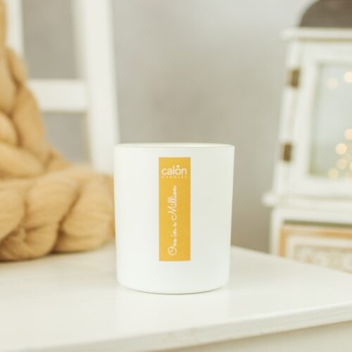 One in a Million candle - gold on white