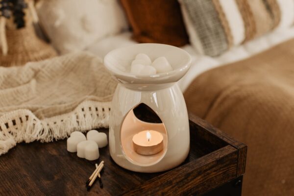 cream burner with heart wax melts in bedroom