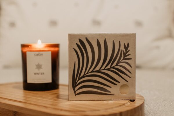 Fern matchbox with amber glass candle