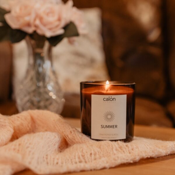 Pink Pepper and Rose summer candle with blanket and flowers