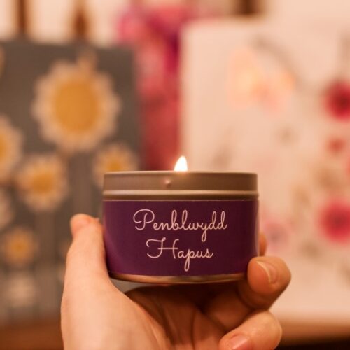penblwydd hapus lit mini candle tin in hands