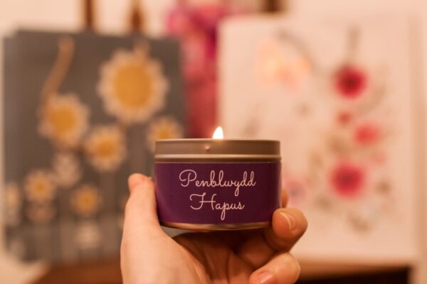 penblwydd hapus lit mini candle tin in hands
